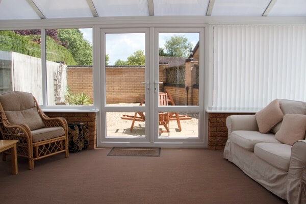 Long Acres holiday cottage conservatory door to garden